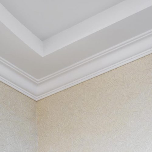 White plinth on the ceiling of drywall. Ceiling repair modern
